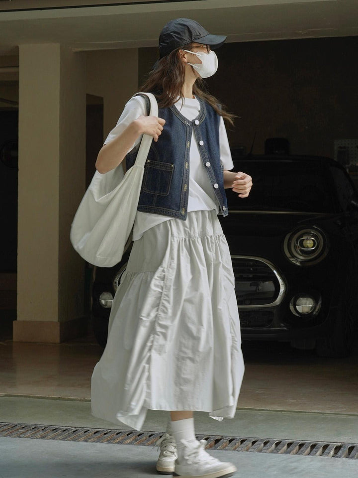 Stylishly wearing a summer elastic waist, lightweight and breathable half length long skirt for women in pink.