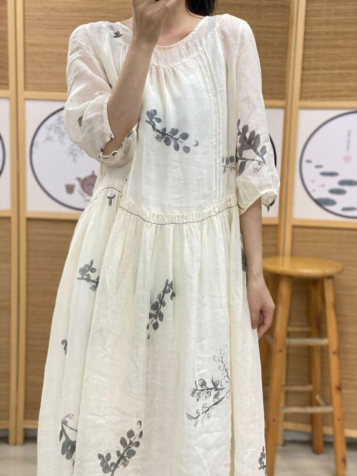 Plus Size Women's Ramie Summer Print Dress features a lightweight white fabric with leaf patterns and a relaxed fit.