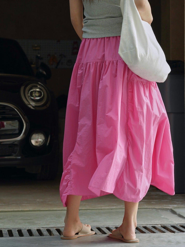 Stylish pink A-line midi skirt, perfect for summer. Elastic waist, lightweight and breathable for women.