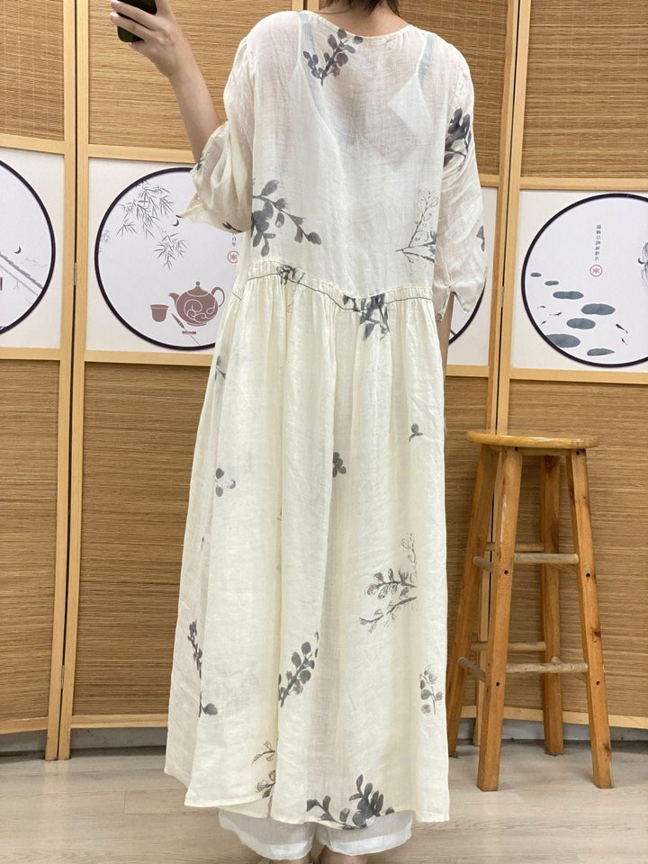 Plus Size Women's Ramie Summer Print Dress features a lightweight white fabric with a lovely leaf print and mid-length design.