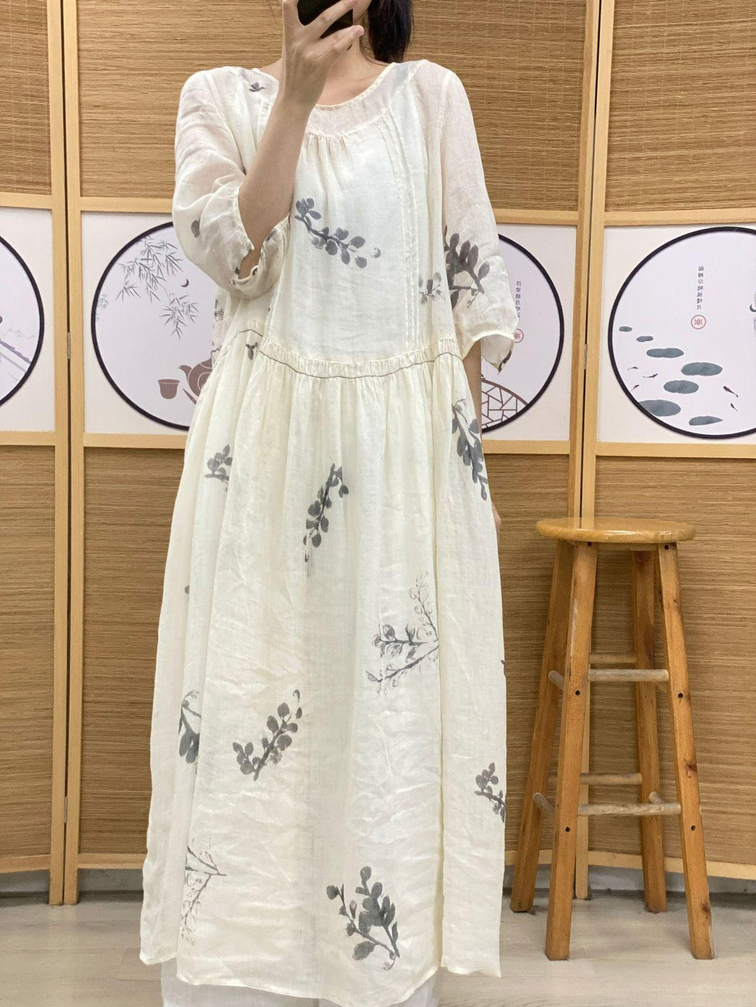 Plus Size Women's Ramie Summer Print Dress features a lightweight, white fabric with leaf prints and a relaxed fit.