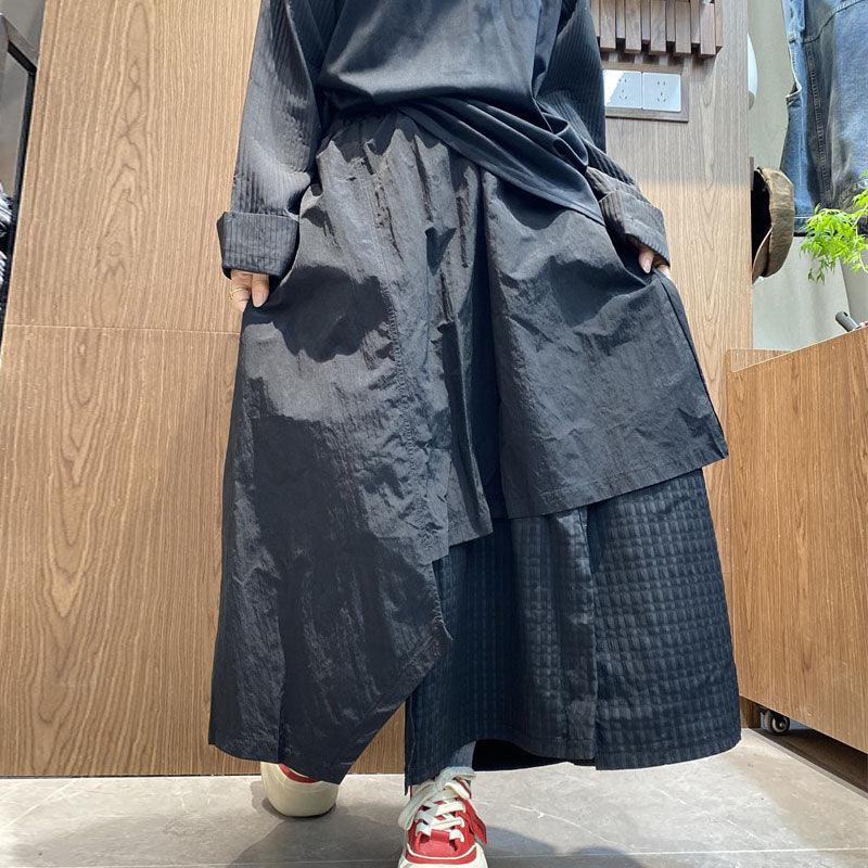 Stylish women's irregular skirt pants with pockets in black, perfect for casual commuting. One size fits all.