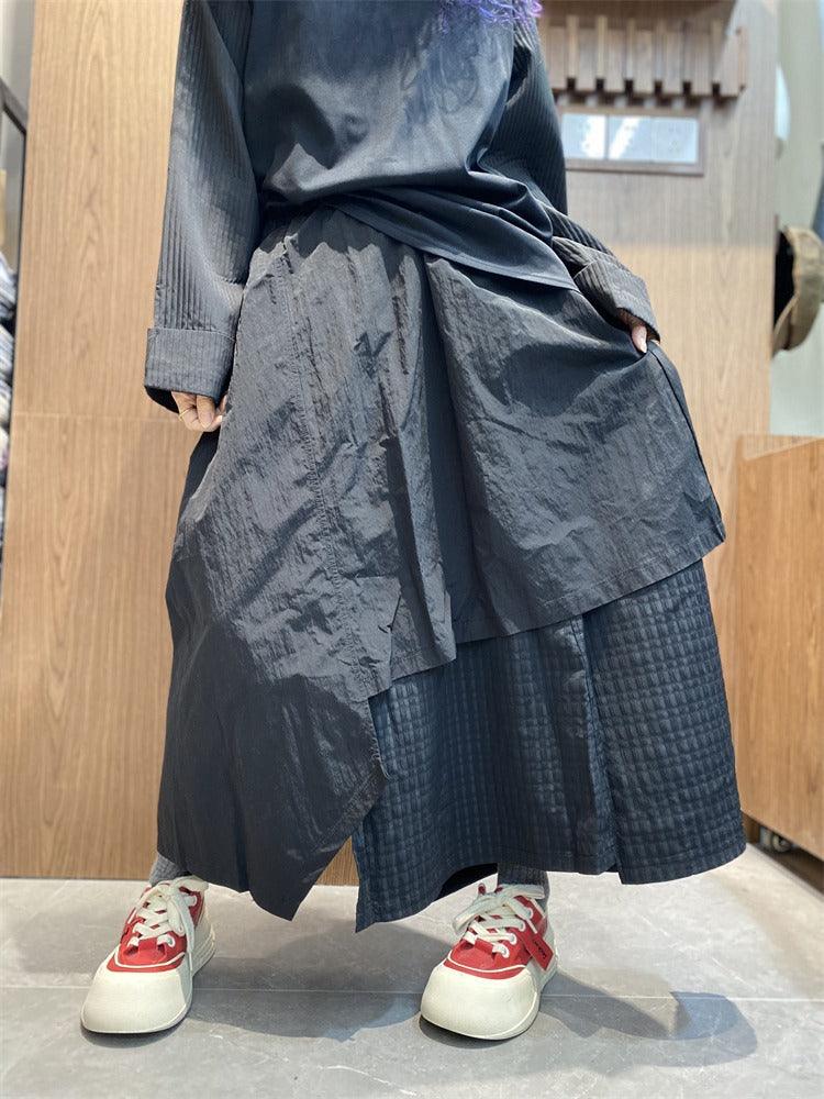 Stylish Women's irregular skirt pants with pockets in black, perfect for casual commuting and featuring an asymmetric design.