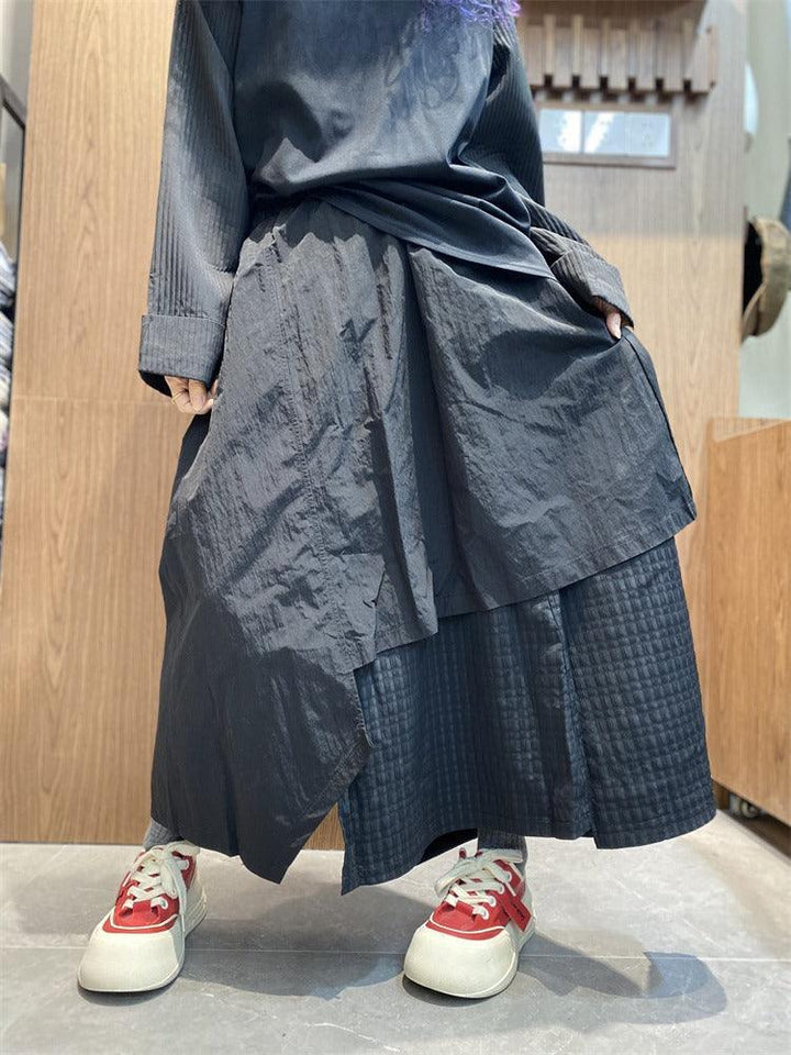 Stylish Women's irregular skirt pants with pockets in black, perfect for casual commuting and featuring an asymmetric design.